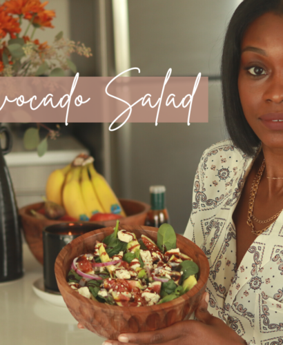 Woman with fig and avocado salad in wooden bowl